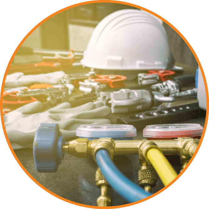 A hard hat is shown among HVAC tools