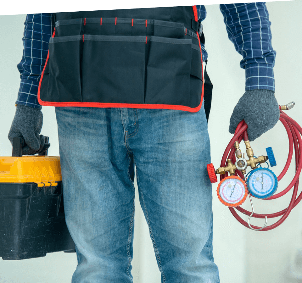 A HVAC contractor holds tools and equipment.