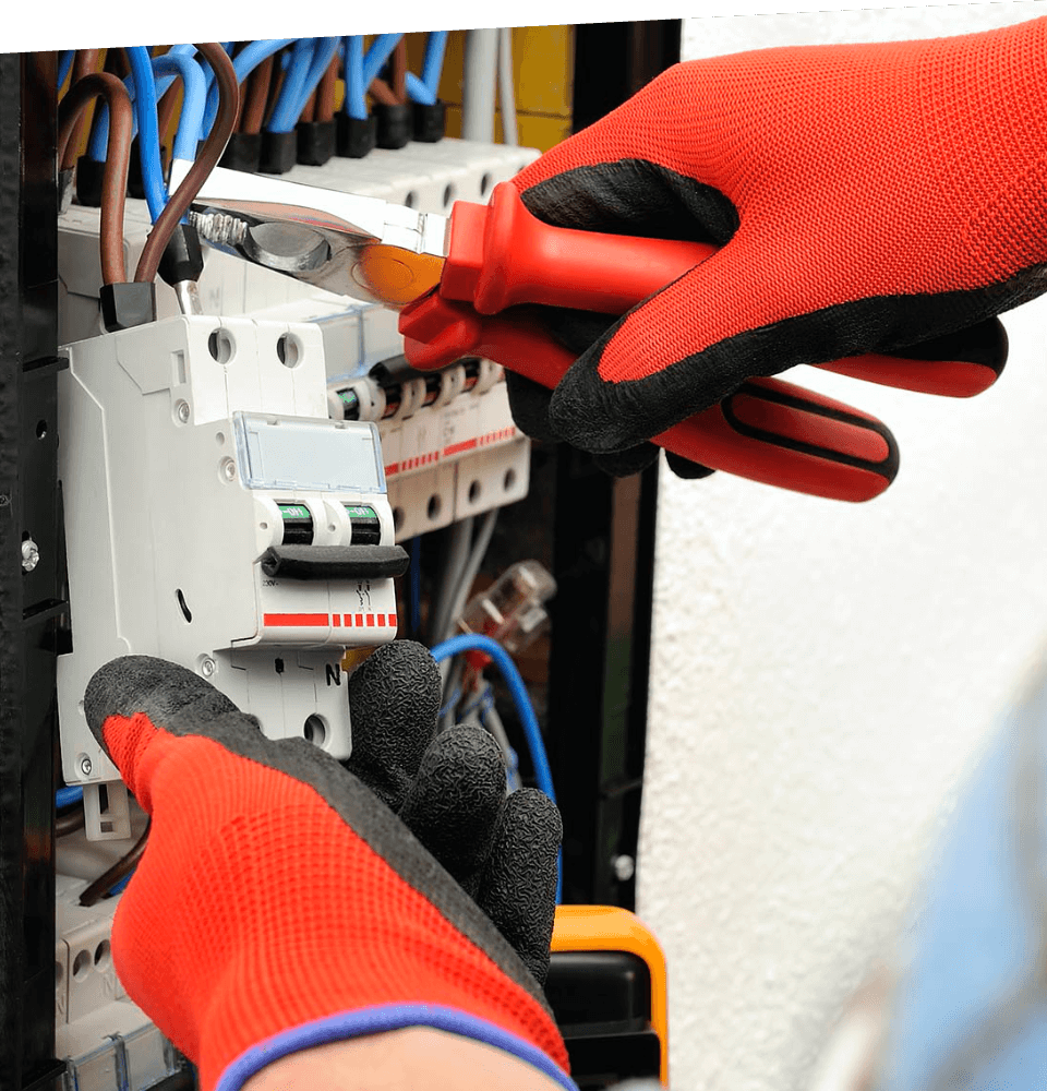 An electrician works on wiring.