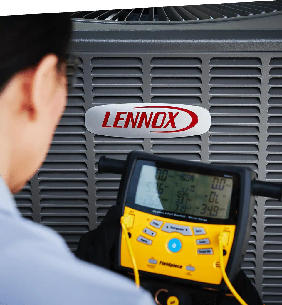 A technician works on an air conditioner