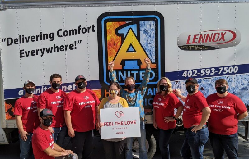A-1 United staff is shown with homeowners who benefitted from the Feel the Love program.